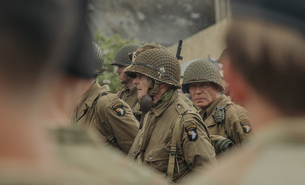 U.S. Army Soldiers and Reenactors March Through Carentan