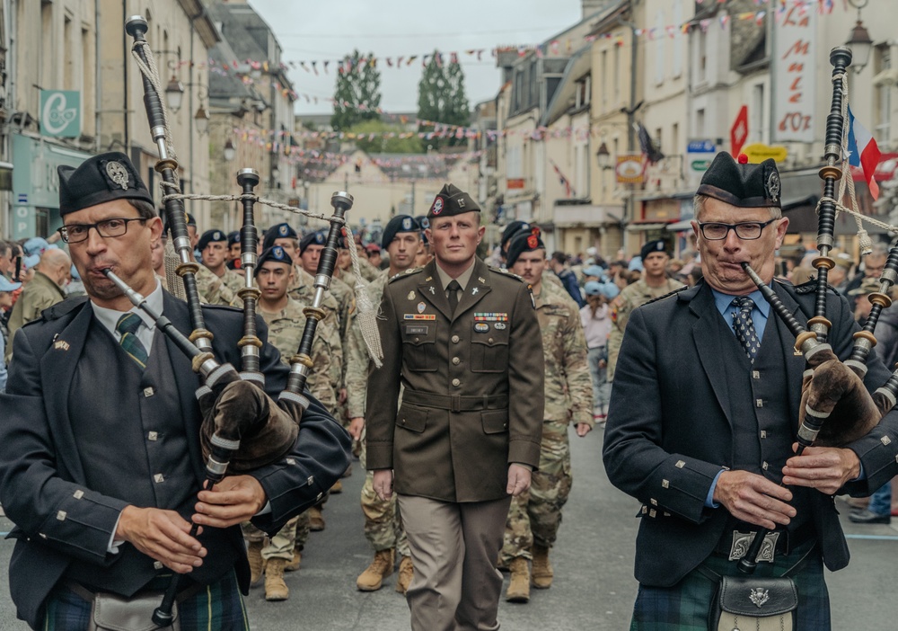 U.S. Army Soldiers and Reenactors March Through Carentan