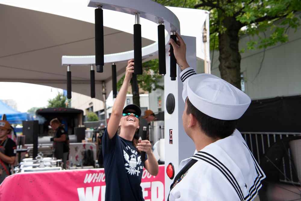 Navy Recruiter Interacts With Crowd