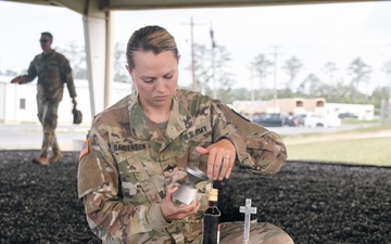 Religious Affairs NCO prepares Sunday chapel service communion
