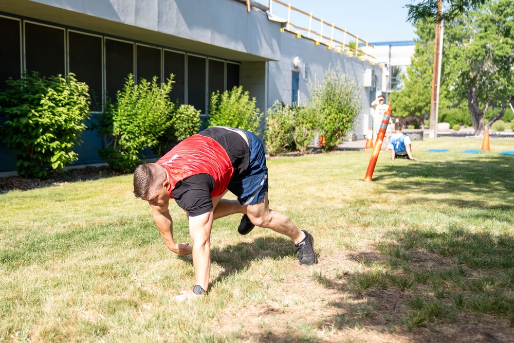 BEAR CRAWL: Airmen compete in a relay race during the UNITE Event at Nevada Air National Guard Base