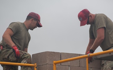 Airmen construct tower for Army weapons range