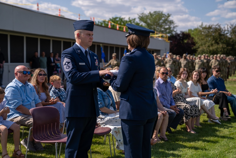Retired Chief Master Sgt. Linton presented with American flag at retreat ceremony