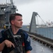 USS Frank Cable (AS 40) departs Majuro
