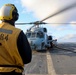 USS Bulkeley refueling team re-fuels a MH-60R Sea Hawk helicopter