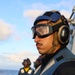 BM1 Youssef Belakbir observes helicopter operations on the flight deck of the Bulkeley