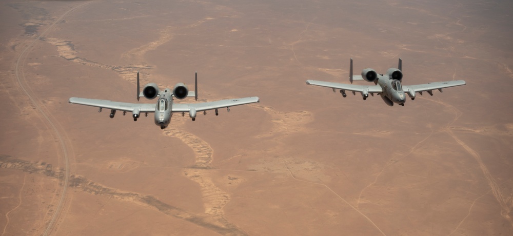 Air Force Thunderbolt II's and Strike Eagles refuel over USCENTCOM AOR
