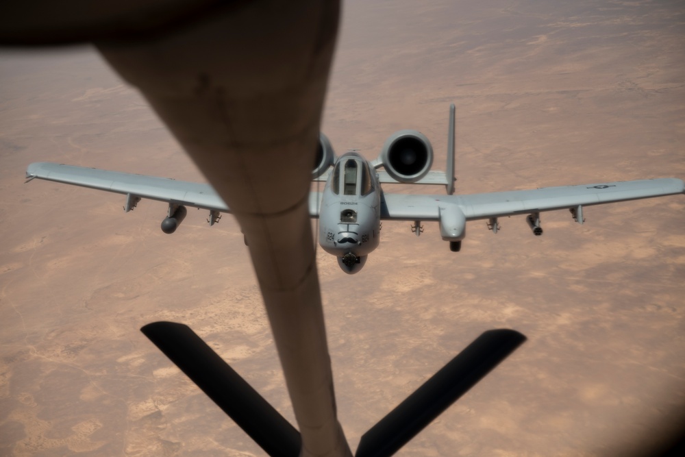 Air Force Thunderbolt II's and Strike Eagles refuel over USCENTCOM AOR