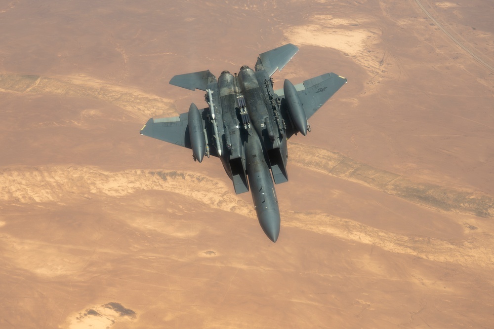 Air Force Thunderbolt II's and Strike Eagles refuel over USCENTCOM AOR