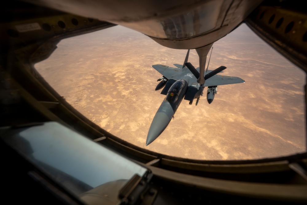 Air Force Thunderbolt II's and Strike Eagles refuel over USCENTCOM AOR
