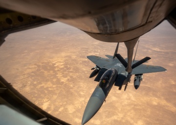 Air Force Thunderbolt II's and Strike Eagles refuel over USCENTCOM AOR