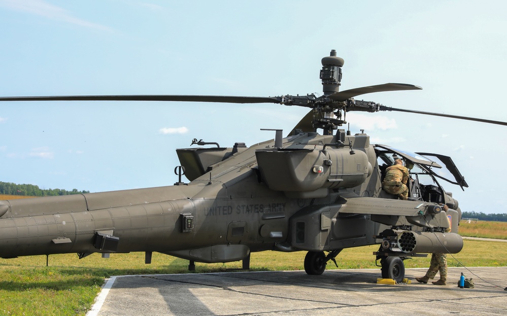 12th CAB conduct preventative maintenance checks and services on AH-64 Apache Attack Helicopter during Saber Guardian 25