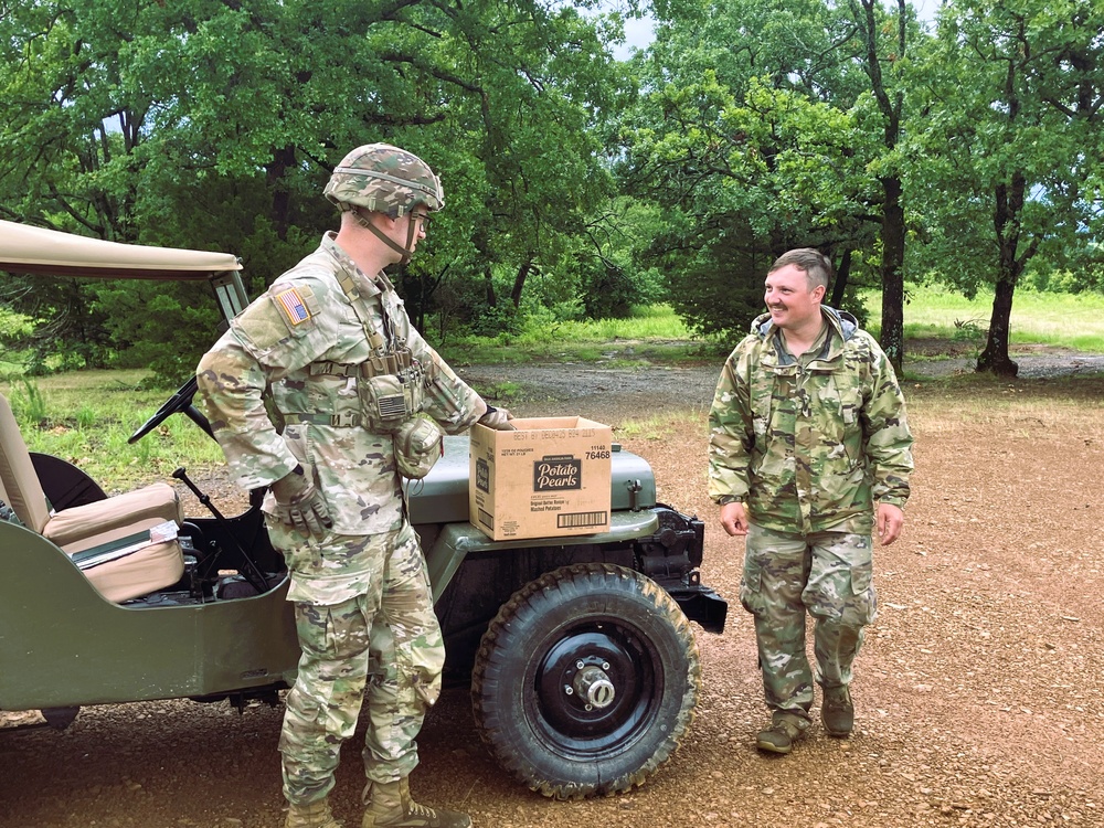 Capt. Comb Drives 1948 Jeep to Boost Morale During Annual Training