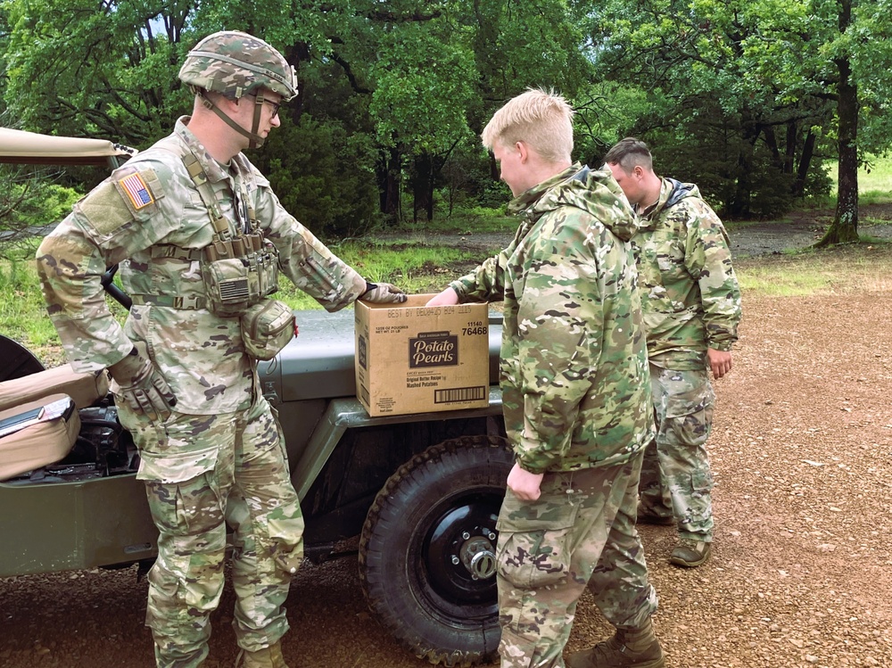 Capt. Comb Drives 1948 Jeep to Boost Morale During Annual Training