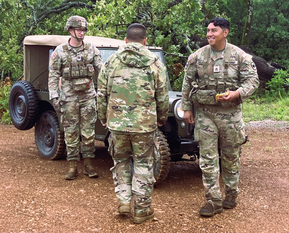 Capt. Comb Drives 1948 Jeep to Boost Morale During Annual Training