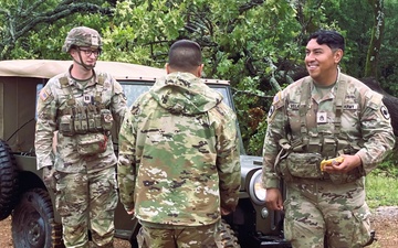 Capt. Comb Drives 1948 Jeep to Boost Morale During Annual Training