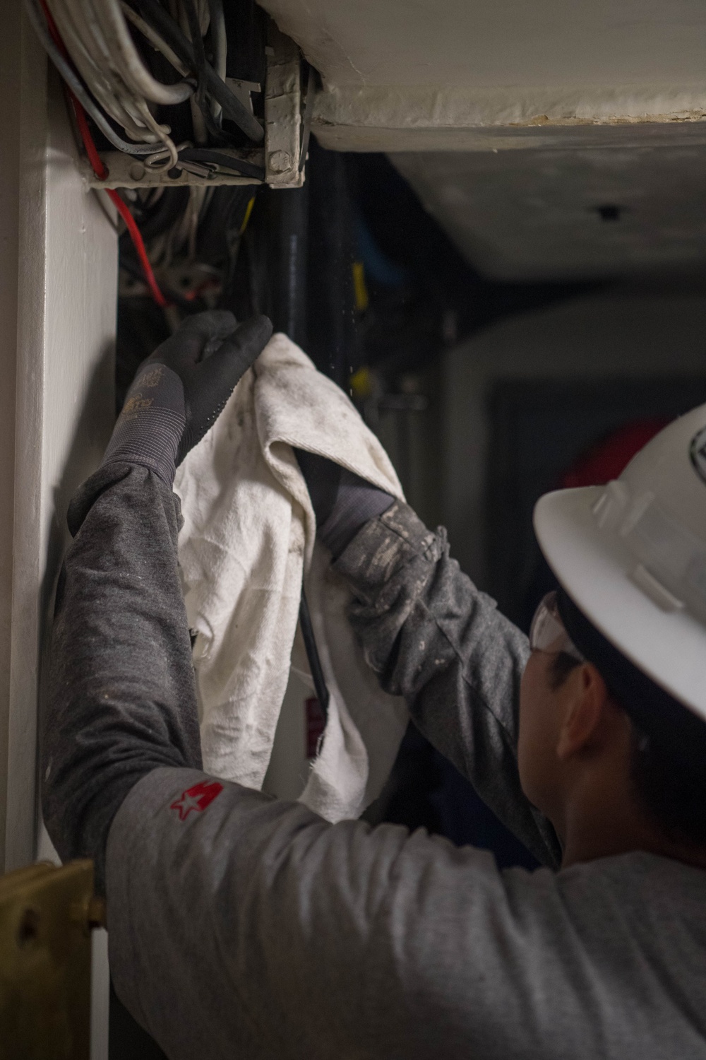 Contractors route cable aboard USS Ronald Reagan (CVN 76)