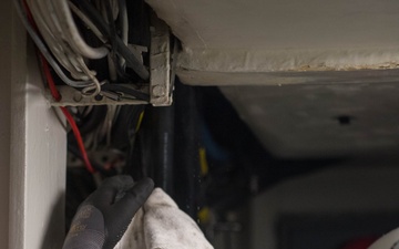 Contractors route cable aboard USS Ronald Reagan (CVN 76)