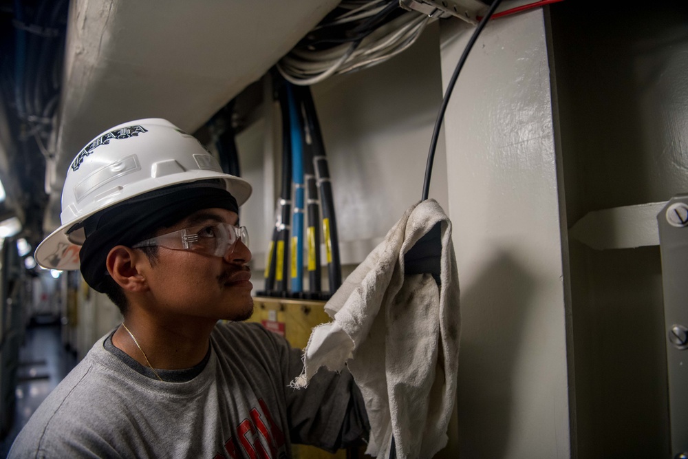 Contractors route cable aboard USS Ronald Reagan (CVN 76)