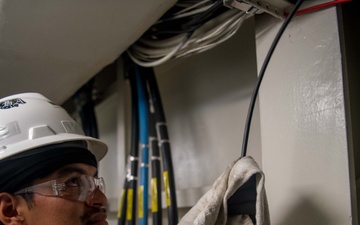 Contractors route cable aboard USS Ronald Reagan (CVN 76)