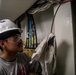 Contractors route cable aboard USS Ronald Reagan (CVN 76)