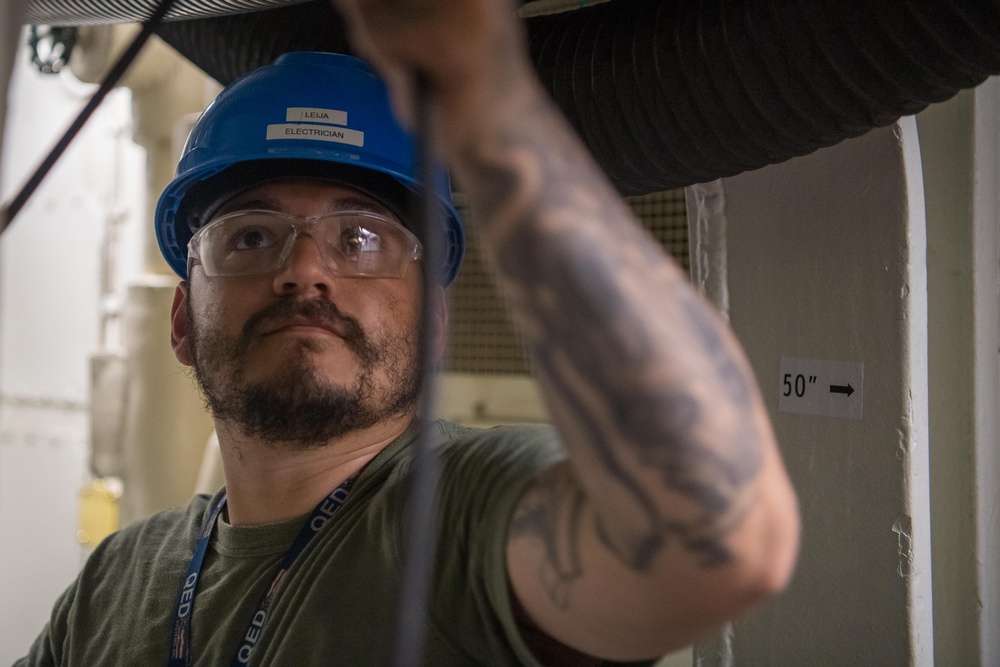 Contractors route cable aboard USS Ronald Reagan (CVN 76)