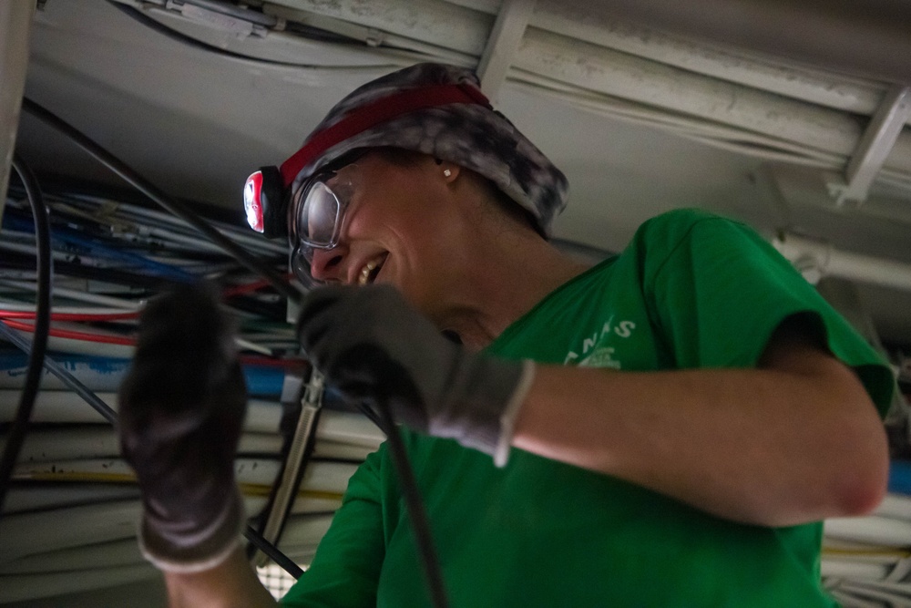 Contractors route cable aboard USS Ronald Reagan (CVN 76)