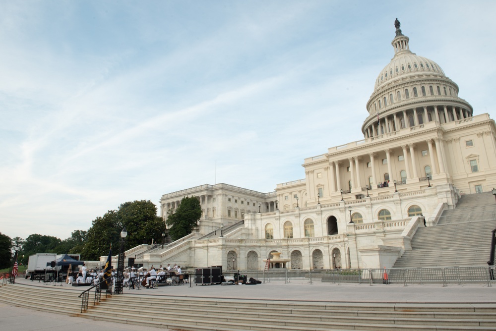 The United States Navy Band performs on the western steps of the United States Capitol Building.