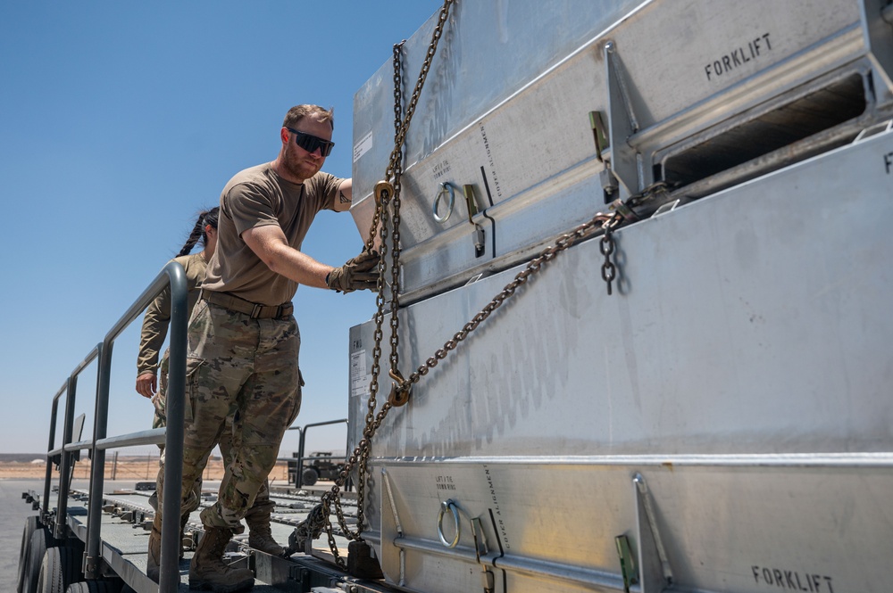 332 ELRS “Port Dawgs” unload equipment from a C-17