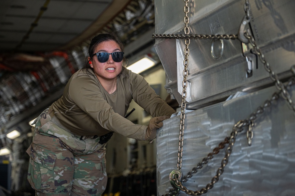 332 ELRS “Port Dawgs” unload equipment from a C-17