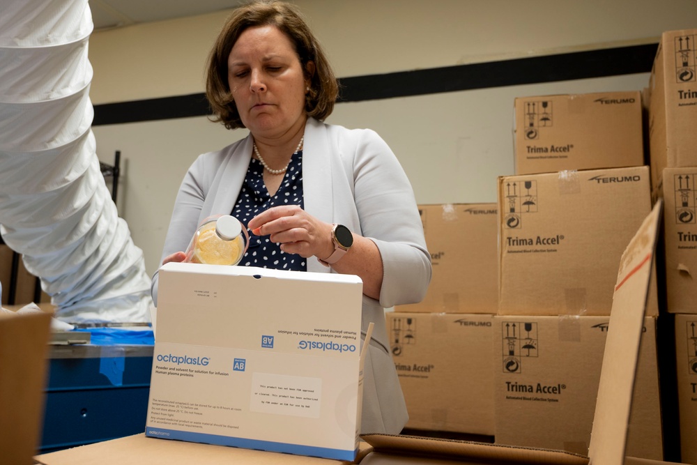 Operational Medical Systems Team inspects a shipment of Freeze-Dried Plasma