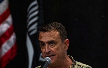 Rear Adm. Joe Cahill delivers remarks