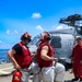 DC3 Levi Nuslein and DC2 Asia Taylor use a fire extinguisher to respond to a simulated fire