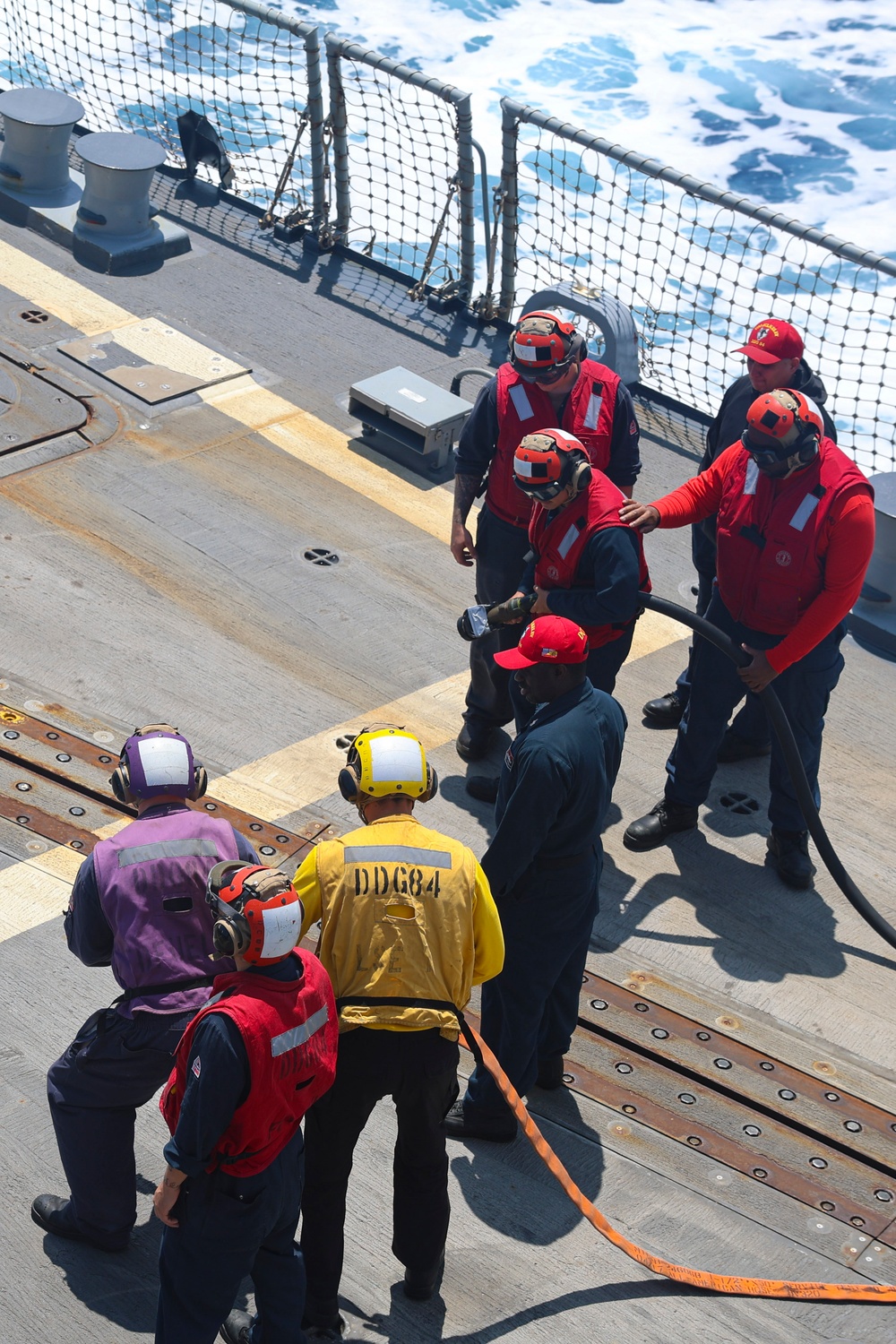 U.S Navy Sailors conduct a simulated fire training exercise on the USS Bulkeley