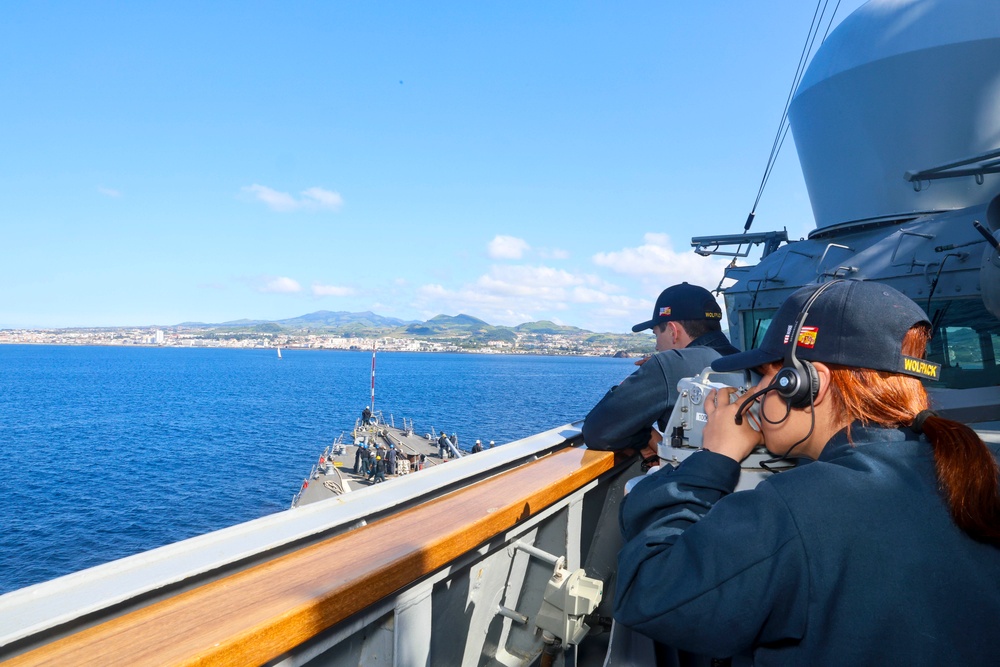 Lt. Cameron Reeves and QMSN Nicole Guijosa observe multiple marine traffic sailing vessels