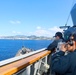 Lt. Cameron Reeves and QMSN Nicole Guijosa observe multiple marine traffic sailing vessels
