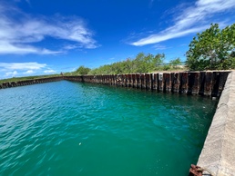 Responders assess Tinian Harbor following clean up of water oil spill