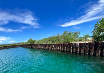 Responders assess Tinian Harbor following clean up of water oil spill