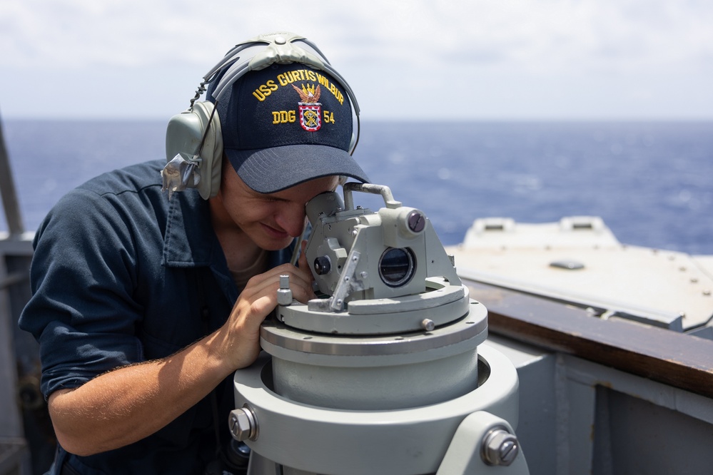 Sailor Stands Lookout Aboard USS Curtis Wilbur (DDG 54)