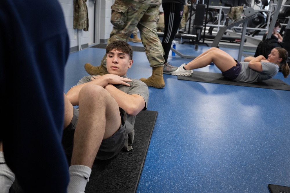 Student flight Airman participate in a mock Air Force Physical Fitness Assessment