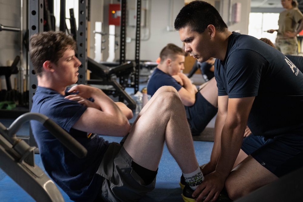 Student flight Airman participate in a mock Air Force Physical Fitness Assessment