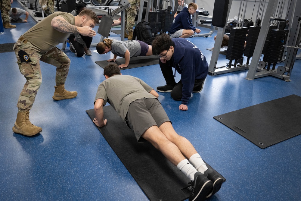 Student flight Airman participate in a mock Air Force Physical Fitness Assessment
