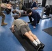 Student flight Airman participate in a mock Air Force Physical Fitness Assessment