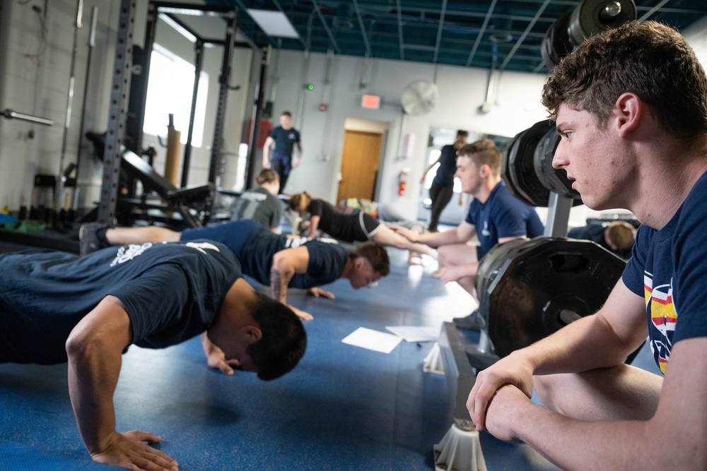 Student flight Airman participate in a mock Air Force Physical Fitness Assessment