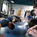 Student flight Airman participate in a mock Air Force Physical Fitness Assessment