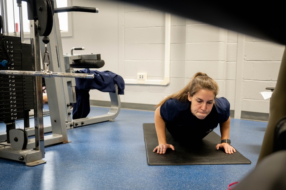 Student flight Airman participate in a mock Air Force Physical Fitness Assessment