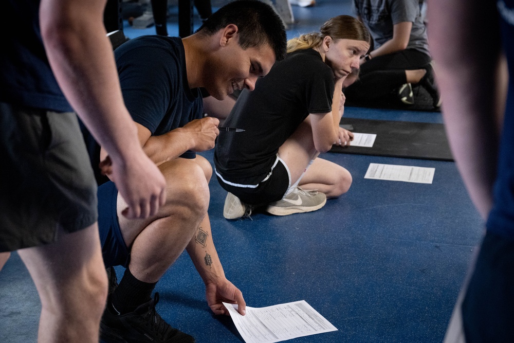 Student flight Airman participate in a mock Air Force Physical Fitness Assessment
