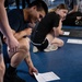 Student flight Airman participate in a mock Air Force Physical Fitness Assessment