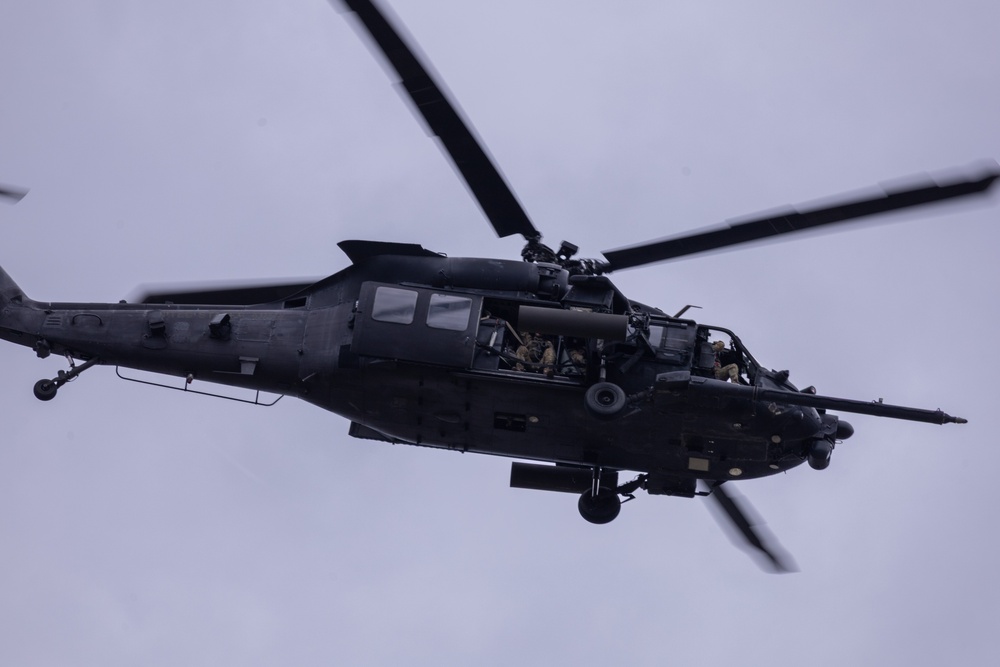 Military aircraft fly over Fort Bragg