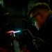 Hull Maintenance Technician anneals a carbon steel pipe while underway in the Pacific Ocean